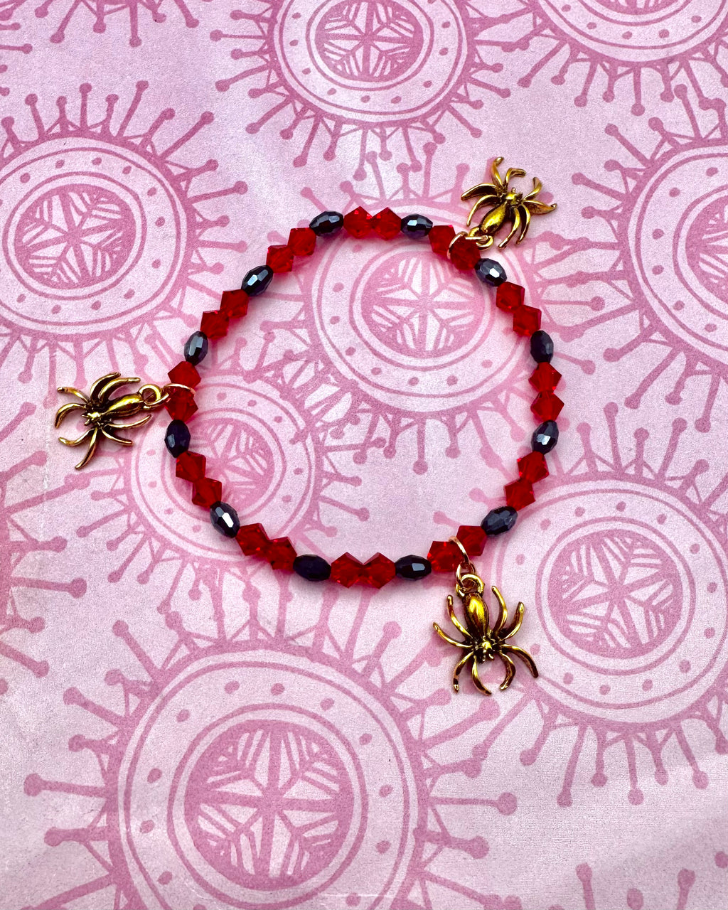 Pulsera de araña de oro rojo y negro