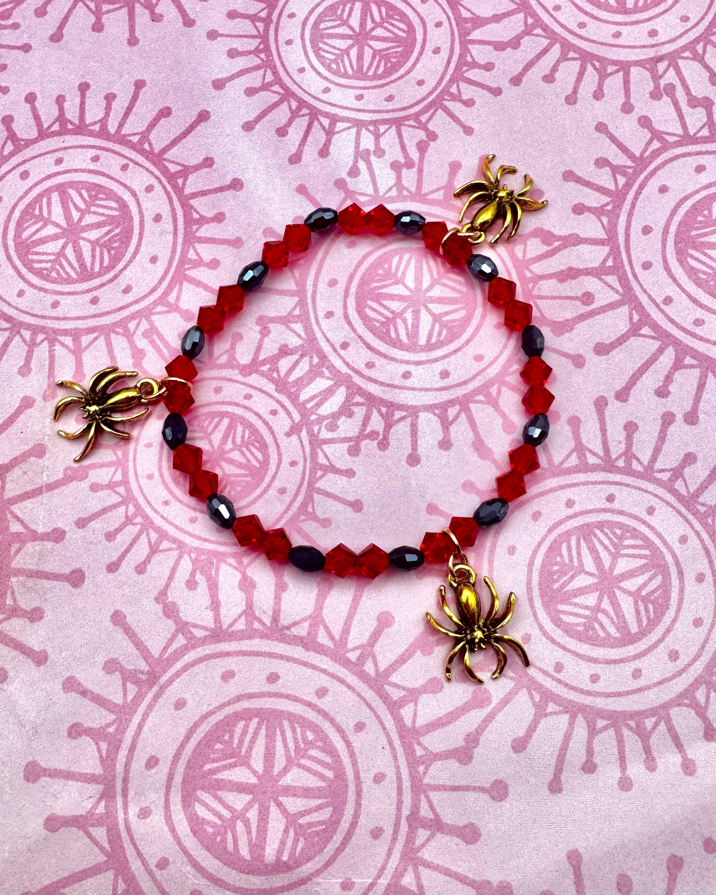 Pulsera de araña de oro rojo y negro
