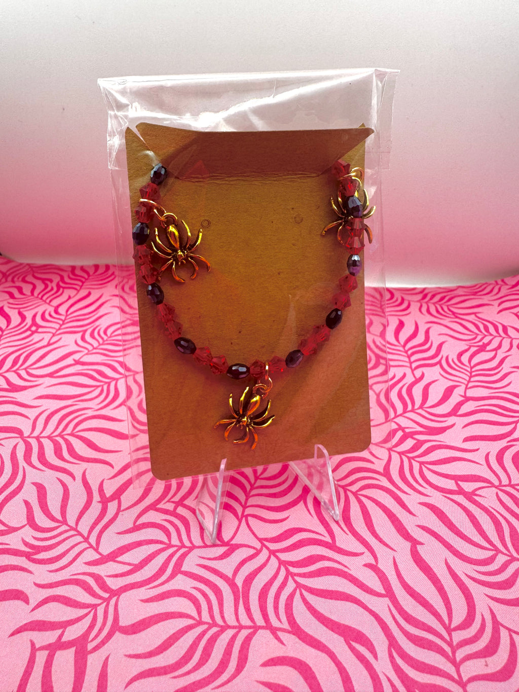 Pulsera de araña de oro rojo y negro